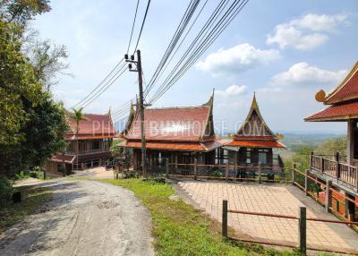 MAI7181: 6 rai of land with 4 Thai Style Houses in Mai Khao