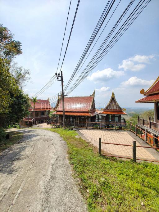 MAI7181: 6 rai of land with 4 Thai Style Houses in Mai Khao