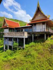 MAI7181: 6 rai of land with 4 Thai Style Houses in Mai Khao