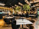 Modern restaurant interior with stylish furniture and ambient lighting