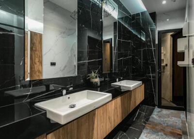 Modern bathroom with dual sink and marble finishes