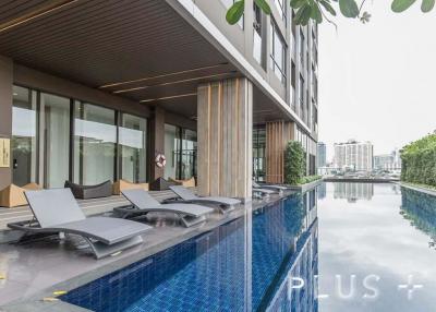 Condo with musical pool + rooftop garden