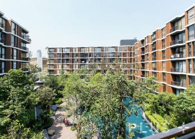 Resort style condo embraced by big trees