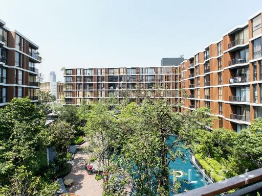 Resort style condo embraced by big trees