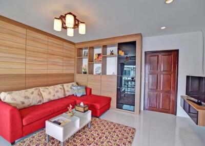 Cozy and modern living room with red sofa and stylish decor