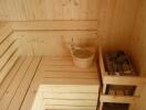 Cozy wooden sauna with benches and stones