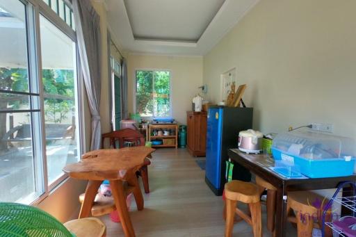 Property with 2 small single storey houses and a large garden in a nice community in Villa Lanna , San Kamphaeng, Chiang Mai