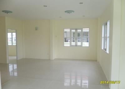 Spacious and brightly lit empty living room with large windows