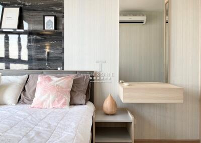 Modern bedroom interior with elegant decor and wooden accents