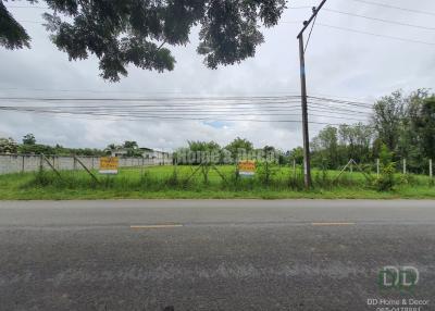 View of a vacant property lot for sale next to a road