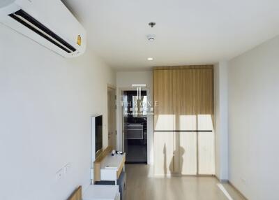 Bright modern living room with built-in wardrobe and air conditioning