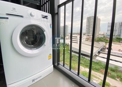 Balcony with washing machine and city view