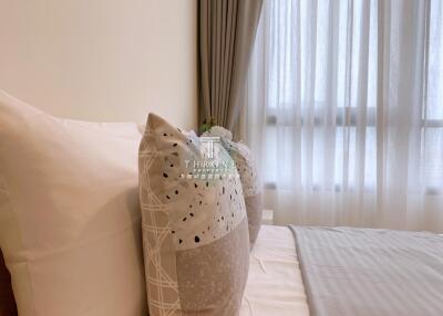 Cozy bedroom with pillows and curtains