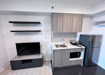 Modern compact kitchen with appliances and shelves