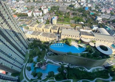 Aerial view of modern building with pool and cityscape