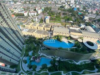 Aerial view of modern building with pool and cityscape