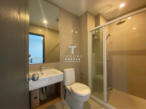 Modern bathroom with shower, toilet, and sink