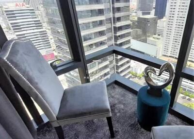 Modern high-rise city view with decorative chairs