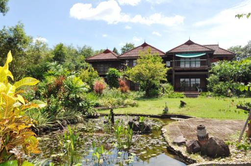 Experience Eco-Tourism Bliss: Remarkable Home & 64+ Rai Land for Sale in Nakhon Phanom, Thailand - A Green Paradise Awaits.