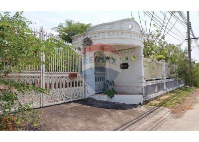 Elegant white residential building with decorative iron gate
