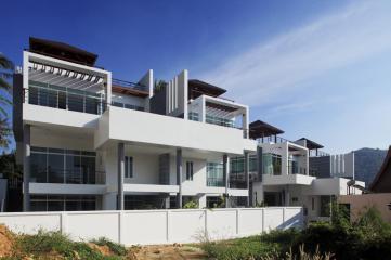 Modern semi-detached pool villas located on a hillside in Kata