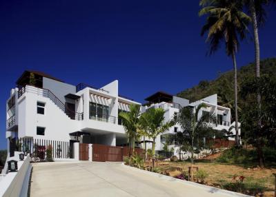Modern semi-detached pool villas located on a hillside in Kata