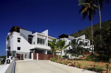 Modern semi-detached pool villas located on a hillside in Kata