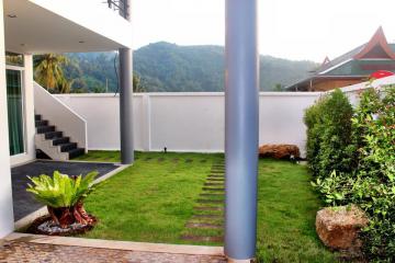 Modern semi-detached pool villas located on a hillside in Kata