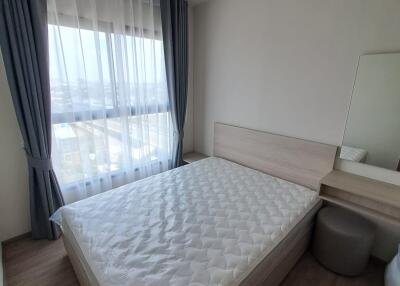 Bedroom with large window and natural light