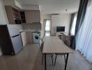 Modern kitchen and dining area with appliances