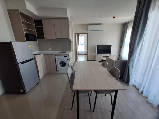 Modern kitchen and dining area with appliances