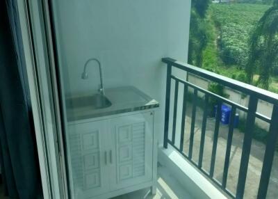 Balcony area with a sink and outdoor view