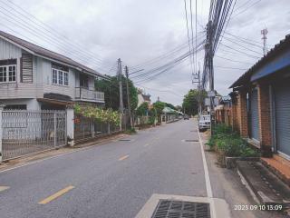 Residential street view with multiple houses and overcast sky