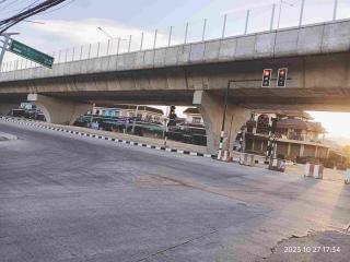 Exterior view of overpass near residential buildings at dusk