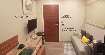 Modern living room with smart TV and digital door lock system