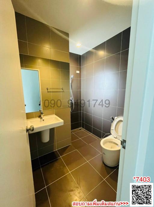 Compact modern bathroom with tiled walls and flooring