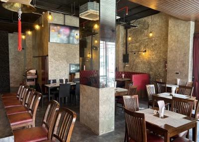 Modern restaurant interior with tables and cozy seating arrangement