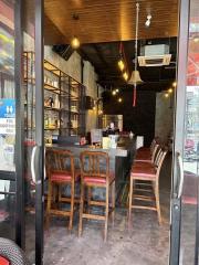 Cozy restaurant interior with bar seating and warm lighting