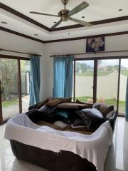 Cozy bedroom with large windows and ample natural light