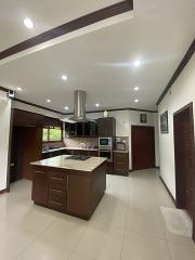 Modern kitchen with central island and stainless steel appliances