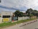 Exterior view of a property for sale with fence and for sale sign