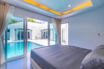 Bright Bedroom with Direct Pool Access and Modern Design