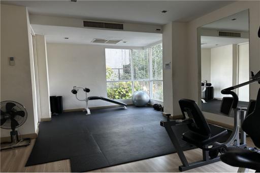 Residential oasis near BTS Thonglor, charming low-rise condo.