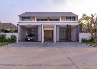 For sale stunning 2-storey house boasts 3 bedrooms with dressing zones, 4 bathrooms, a spacious living room, and both Western and Thai kitchens