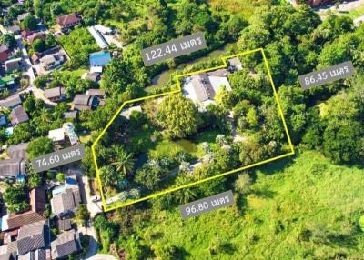 Prime land for sale in Hang Dong, Chiang Mai, adjacent to premium outlets. Excellent location for investment or developing a housing estate.
