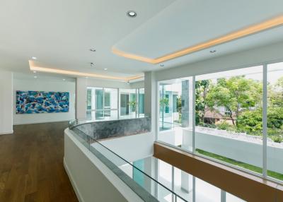 Luxurious modern home with 8 bedrooms, multiple living spaces, fitness and study areas, dual kitchens, saltwater pool, in peaceful Hang Dong village.