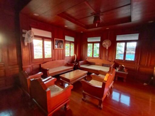 "Centrally-located Lanna-style Teak House for sale in Chiang Mai. Well-maintained with beautiful interior & exterior. Don