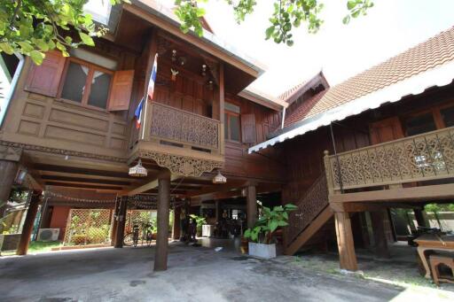 "Centrally-located Lanna-style Teak House for sale in Chiang Mai. Well-maintained with beautiful interior & exterior. Don