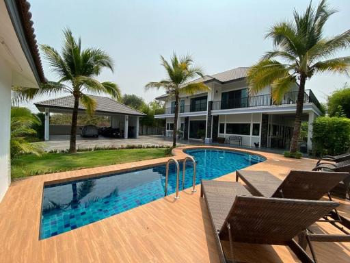 Fully furnished 5BR home near Maejo University with pool, gym/office space, and wraparound balcony. Solar power, 2-car parking, and easy access to town