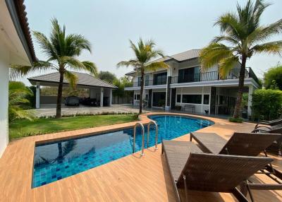 Fully furnished 5BR home near Maejo University with pool, gym/office space, and wraparound balcony. Solar power, 2-car parking, and easy access to town